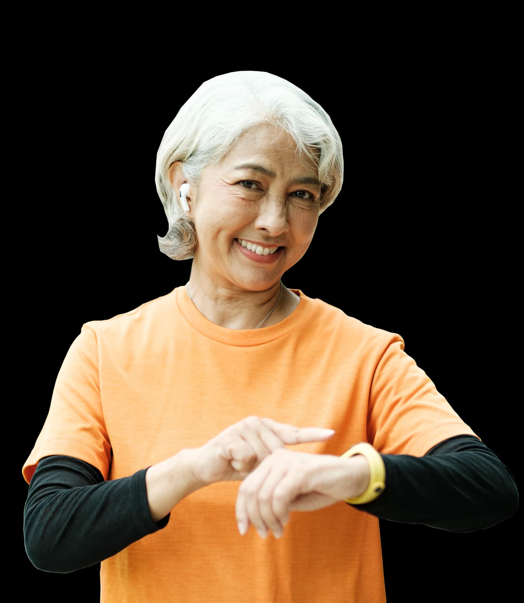 Happy athletic senior woman checking smartwatch